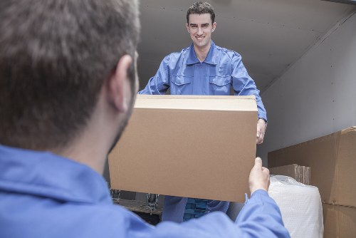 Removal team planning a home move on a Chiswick residential street
