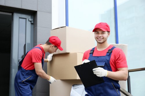 Student moving boxes outside a Chiswick home