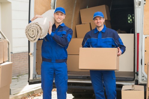 Van loading recyclable cardboard and furniture for a sustainable move in Chiswick