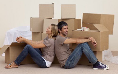 Professional removals team handling furniture in Chiswick