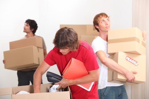 Office move with desks and boxes being transported