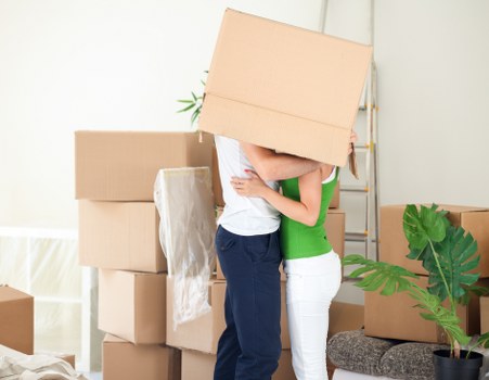 Professional movers carrying furniture in Chiswick